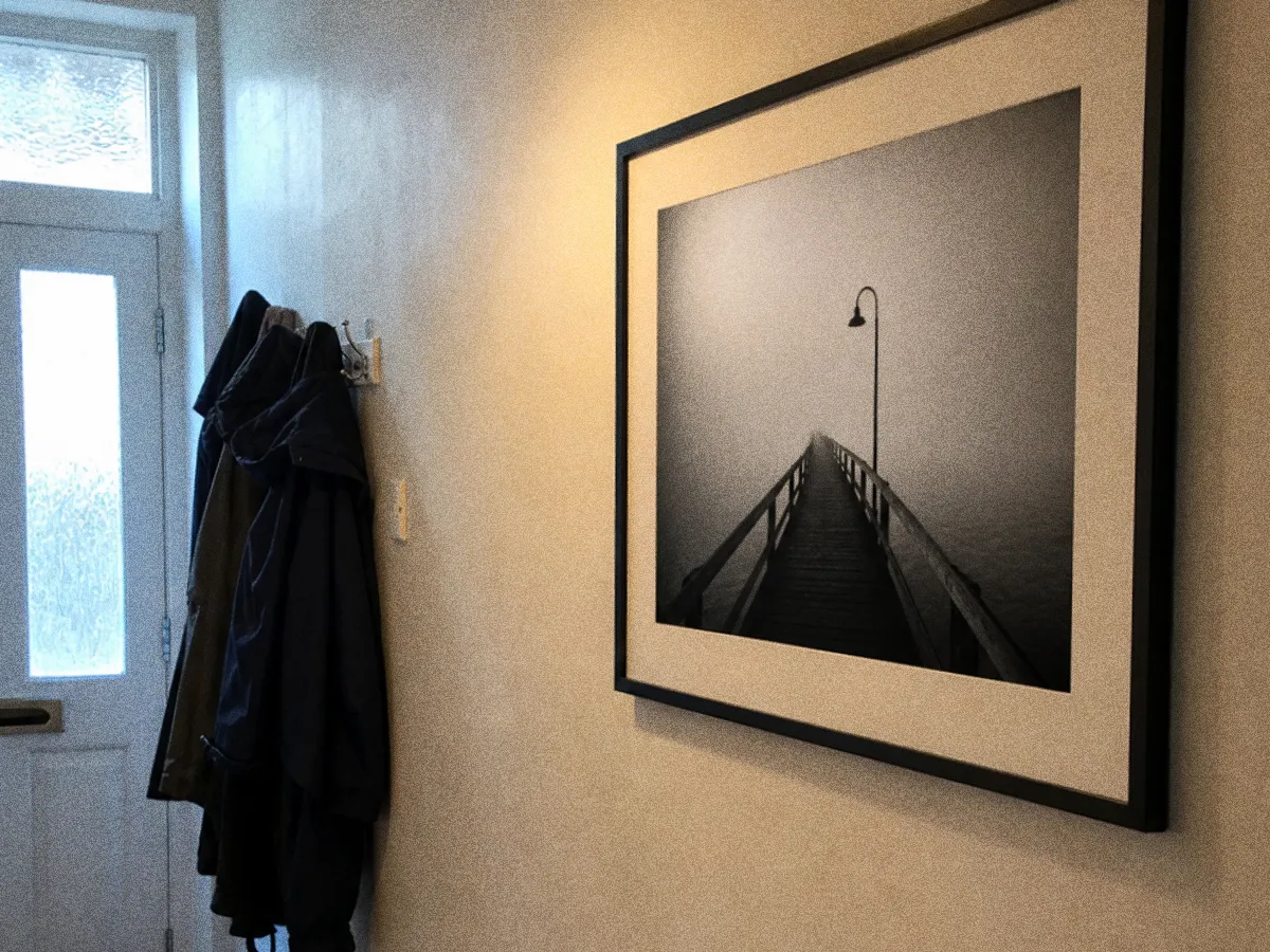 Illustrative mockup of a framed print in a hallway